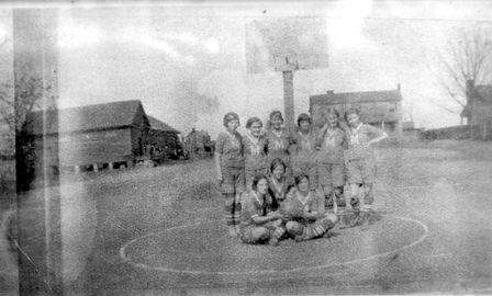 Monticello girl’s basketball team in 1918. Note the two story house behind the team was the house that burned and was replaced by the current McMeekin home. The Monticello store and P.O. can also be viewed to the right rear of the team who had just recently beat their rivals Mt. Zion.