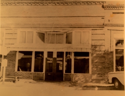 The original Sharon Post Office sat in a row of building next to the Sharon Bank building along Woodlawn Street.